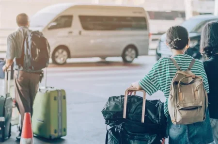 depositphotos_270884102-stock-photo-passengers-with-big-roller-luggage